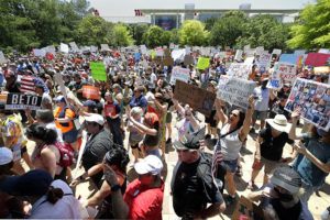 Protesters gather outside as NRA meets in Houston after Texas school massacre