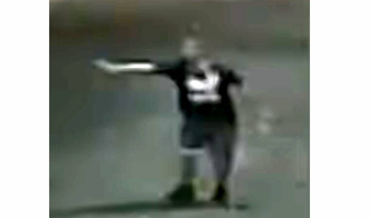 COURTESY HONOLULU POLICE DEPARTMENT
                                This image made from a video shows a suspect firing a pistol.