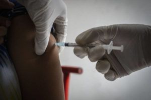 ASSOCIATED PRESS
                                A woman receives her third dose of vaccine for COVID-19.