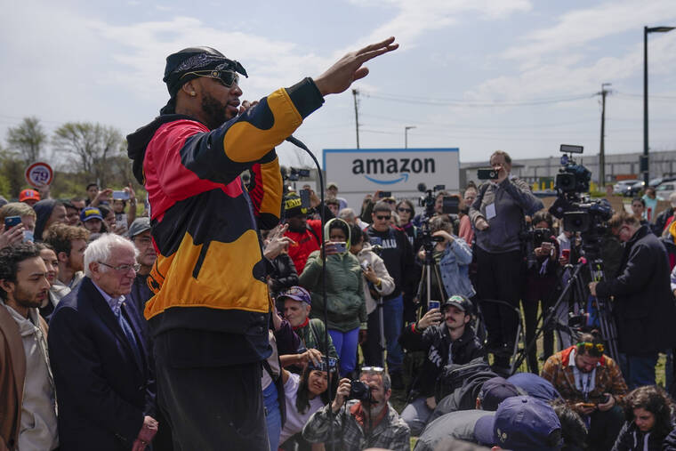 ASSOCIATED PRESS / APRIL 24
                                Christian Smalls, president of the Amazon Labor Union, speaks at a rally outside an Amazon facility on Staten Island in New York,. Amazon and the nascent group that successfully organized the company’s first-ever U.S. union are headed for a rematch Monday, May 2, when a federal labor board will tally votes cast by warehouse workers in yet another election on Staten Island.