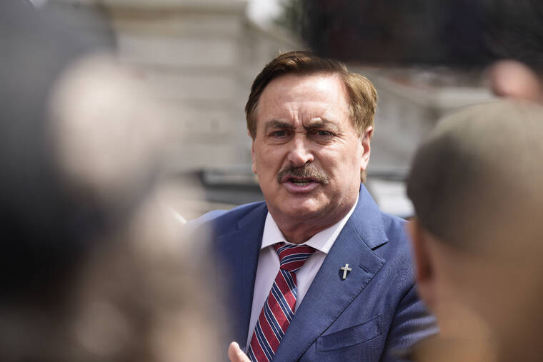 ASSOCIATED PRESS / APRIL 5
                                Mike Lindell, chief executive officer of MyPillow, talks to reporters before attending a rally outside the State Capitol in downtown Denver. Lindell was banned from Twitter for a second time after attempting to use a new account to access the social media platform. Lindell set up a new account on Twitter on Sunday, May 1, under @MikeJLindell. But the account was quickly suspended.