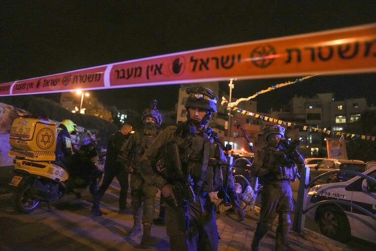 MAYA ALLERUZZO / AP
                                Israeli forces secure the area of a stabbing attack in the town of Elad, Israel.