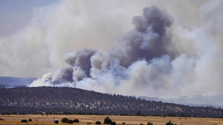 THE ALBUQUERQUE JOURNAL / AP / MAY 4
                                Smoke rises from wildfires near Las Vegas, N.M.