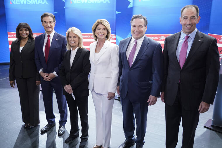 ASSOCIATED PRESS / MAY 4
                                Kathy Barnette, Mehmet Oz, moderator Greta Van Susteren, Carla Sands, David McCormick, and Jeff Bartos, (left to right) pose for photo before they take part in a debate for Pennsylvania U.S. Senate Republican candidates in Grove City, Pa.