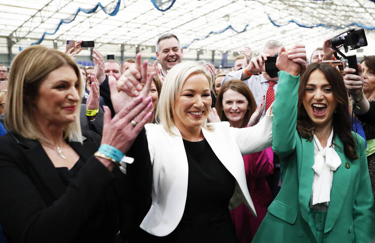 ASSOCIATED PRESS / MAY 6
                                Sinn Fein’s Vice President Michelle O’Neill, centre, celebrates with party colleagues after being elected in Mid Ulster at the Medow Bank election count centre in Magherafelt , Northern Ireland.