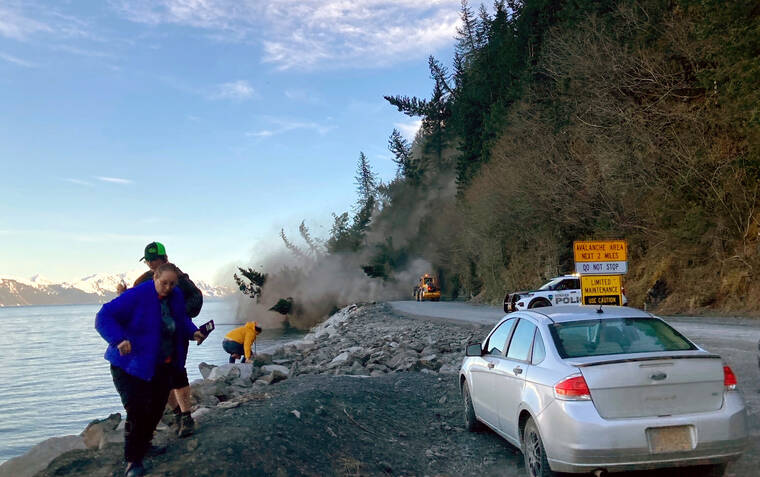 JANETTE BOWER VIA AP / MAY 7
                                People run from a landslide just outside the downtown area of Seward, Alaska. There were no reported injuries in the landslide, which the city estimates could take up to two weeks to clear.