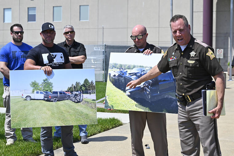 ASSOCIATED PRESS
                                Vandenburgh County Sheriff Dave Wedding, right, referred to a photograph during a press conference in Evansville, In., today, about the capture of fugitives Casey White and Vicky White.
