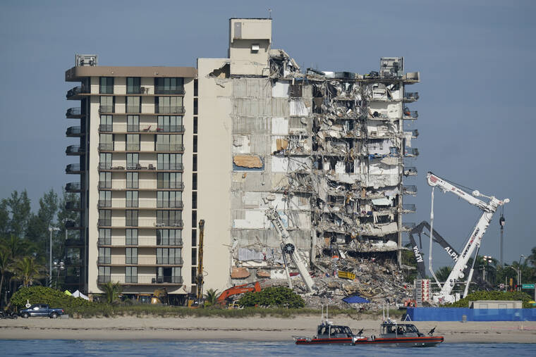 ASSOCIATED PRESS / 2021
                                Coast Guard boats patrol in front of the partially collapsed Champlain Towers South condo building in Surfside, Fla.