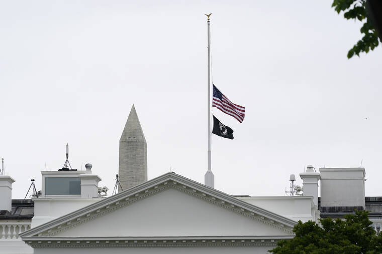ASSOCIATED PRESS
                                The American flag flew at half-staff at the White House in Washington, today, as the Biden administration commemorated 1 million American lives lost due to COVID-19.