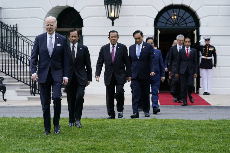 ASSOCIATED PRESS
                                President Joe Biden and leaders from the Association of Southeast Asian Nations (ASEAN) arrive for a group photo on the South Lawn of the White House in Washington.