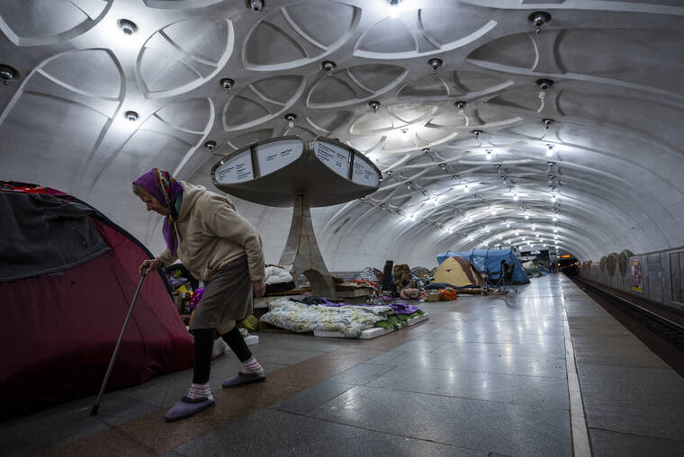 ASSOCIATED PRESS
                                An elderly woman walked inside a metro station being used as a bomb shelter in Kharkiv, Ukraine, Thursday.