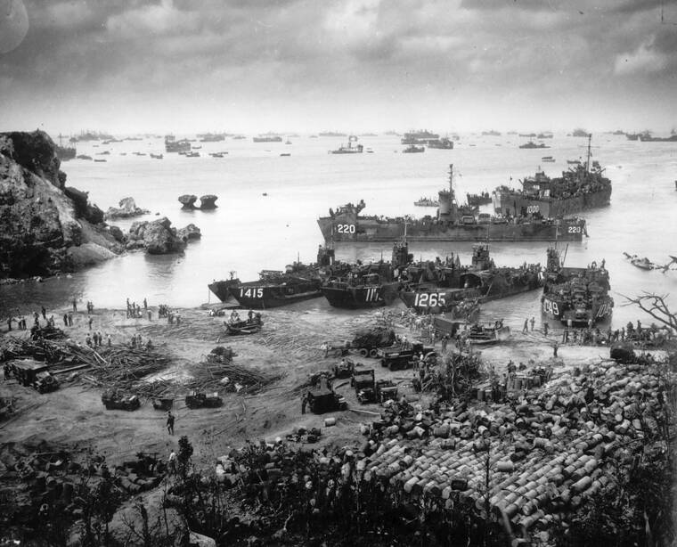 U.S. COAST GUARD / AP
                                In this photo provided by the U.S. Coast Guard, U.S. invasion forces establish a beachhead on Okinawa island, about 350 miles from the Japanese mainland, on April 13, 1945.