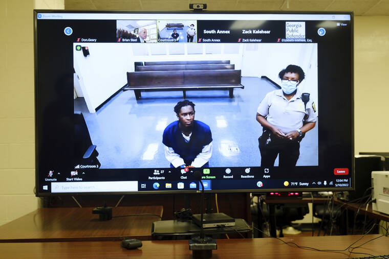 ATLANTA JOURNAL-CONSTITUTION / AP / MAY 10
                                Atlanta rapper Young Thug, whose real name is Jeffery Lamar Williams, is displayed on a monitor as he waits during a virtual appearance before a Fulton County Magistrate judge.