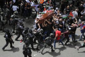 ASSOCIATED PRESS / MAY 13
                                Israeli police confront with mourners as they carry the casket of slain Al Jazeera veteran journalist Shireen Abu Akleh during her funeral in east Jerusalem.