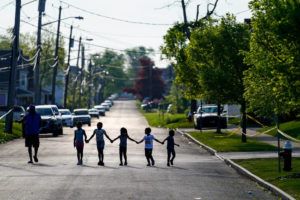 ASSOCIATED PRESS
                                Children walk hand in hand out near the scene of a shooting at a supermarket in Buffalo, N.Y.