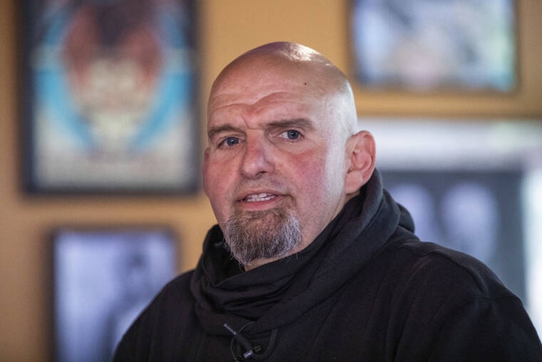 MARK PYNES/THE PATRIOT-NEWS VIA AP / MAY 12
                                John Fetterman speaks to supporters at the Holy Hound Tap Room in downtown York, Pa., while campaigning for U.S. Senate seat.