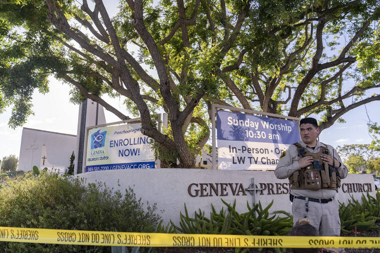 ASSOCIATED PRESS
                                An Orange County Sheriff’s Department officer guards the grounds at Geneva Presbyterian Church in Laguna Woods, Calif., Sunday after a fatal shooting.