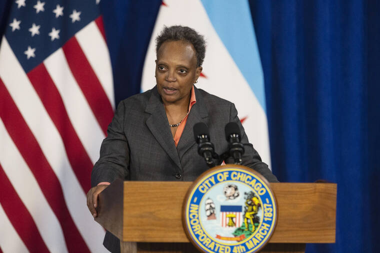 ANTHONY VAZQUEZ/CHICAGO SUN-TIMES VIA AP / MAY 9
                                Mayor Lori Lightfoot speaks during a news conference at City Hall in Chicago. A curfew banning unaccompanied minors will be implemented to combat violence after a 16-year-old boy was fatally shot near “The Bean” sculpture in downtown Chicago’s Millennium Park, which is among the city’s most popular tourist attractions, city officials said Sunday, May 15. “This senseless loss of life is utterly unacceptable,” Lightfoot said in a statement.