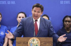 JOE BURBANK/ORLANDO SENTINEL VIA AP / MAY 16
                                Florida Gov. Ron DeSantis answers questions during a news conference at Seminole State College in Sanford, Fla.