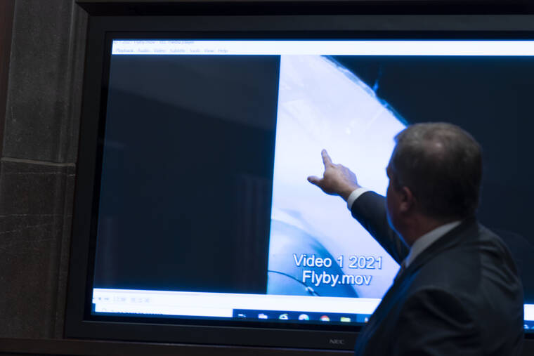 ASSOCIATED PRESS
                                Deputy Director of Naval Intelligence Scott Bray pointed to a video display of a UAP during a hearing of the House Intelligence, Counterterrorism, Counterintelligence, and Counterproliferation Subcommittee hearing on “Unidentified Aerial Phenomena,” on Capitol Hill, today, in Washington.