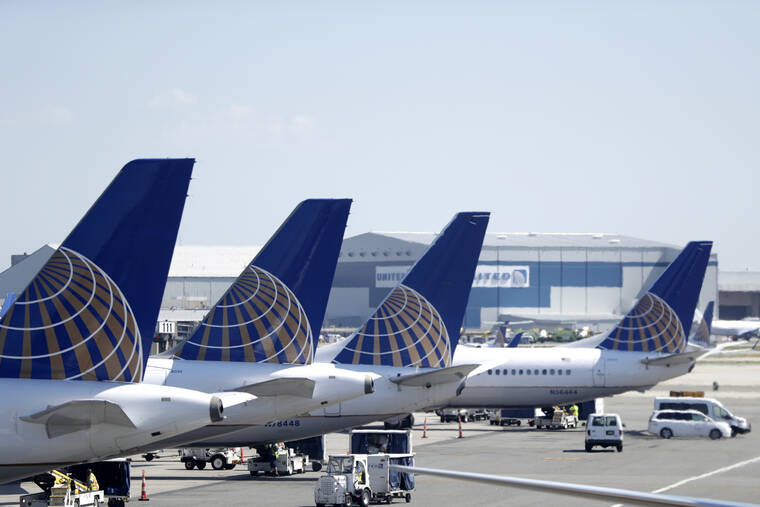 ASSOCIATED PRESS
                                United Airlines commercial jets sat at a gate at Terminal C of Newark Liberty International Airport, in July 2018, in Newark, N.J. Federal safety regulators have approved steps that will let United Airlines resume using dozens of Boeing 777 jets that have been grounded since the engine on one plane blew apart over Denver last year.