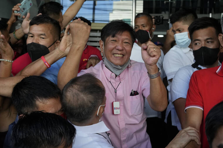 ASSOCIATED PRESS
                                Presidential candidate Ferdinand “Bongbong” Marcos Jr. celebrated as he greeted the crowd outside his headquarters in Mandaluyong, Philippines on Wednesday. Human rights activists have asked the Philippine Supreme Court to block Congress from proclaiming Ferdinand Marcos Jr. as the next president, alleging that he lied when he said he had not been convicted of any crime.