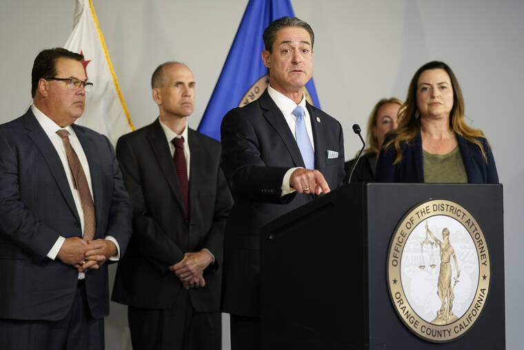 ASSOCIATED PRESS
                                Orange County District Attorney Todd Spitzer, center, spoke during a news conference, today, in Santa Ana, Calif. Spitzer gave an update on the criminal charges in Sunday’s shooting at Geneva Presbyterian Church.