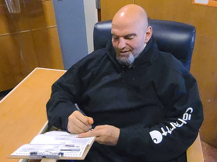 BOBBY MAGGIO VIA AP
                                Pennsylvania Lt. Governor and Democratic Party candidate for a U.S. Senate John Fetterman fills out his emergency absentee ballot for the Pennsylvania primary election in Penn Medicine Lancaster General Hospital in Lancaster, Pa., today.