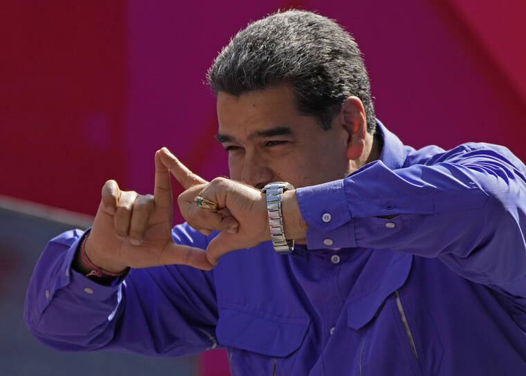 ASSOCIATED PRESS
                                Venezuela’s President Nicolas Maduro gestures on stage during a May Day rally in Caracas, Venezuela, on May 1.
