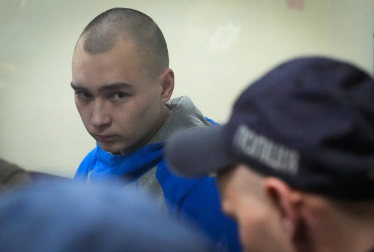 ASSOCIATED PRESS
                                Russian army Sergeant Vadim Shishimarin, 21, was seen behind a glass during a court hearing in Kyiv, Ukraine, today. The Russian soldier facing the first war crimes trial since Moscow invaded Ukraine pleaded guilty today to killing an unarmed civilian.