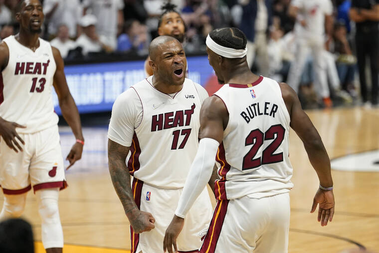 ASSOCIATED PRESS
                                Miami Heat forward P.J. Tucker (17) and forward Jimmy Butler (22) celebrated during the second half of Game 1 of an NBA basketball Eastern Conference finals playoff series against the Boston Celtics, Tuesday, in Miami.