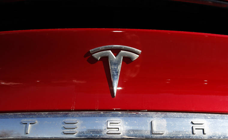 ASSOCIATED PRESS / 2020
                                The Tesla company logo sits on a vehicle at a Tesla dealership in Littleton, Colo. The U.S. government’s road safety agency has dispatched a team to investigate the possibility that a Tesla involved in a California crash that killed three people was operating on a partially automated driving system. The National Highway Traffic Safety Administration on Wednesday, May 18, confirmed that it had sent a special crash investigation team to probe the May 12 crash on the Pacific Coast Highway in Newport Beach.