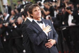 INVISION / AP
                                Tom Cruise poses for photographers upon arrival at the premiere of the film ‘Top Gun: Maverick’ at the 75th international film festival, Cannes, southern France.