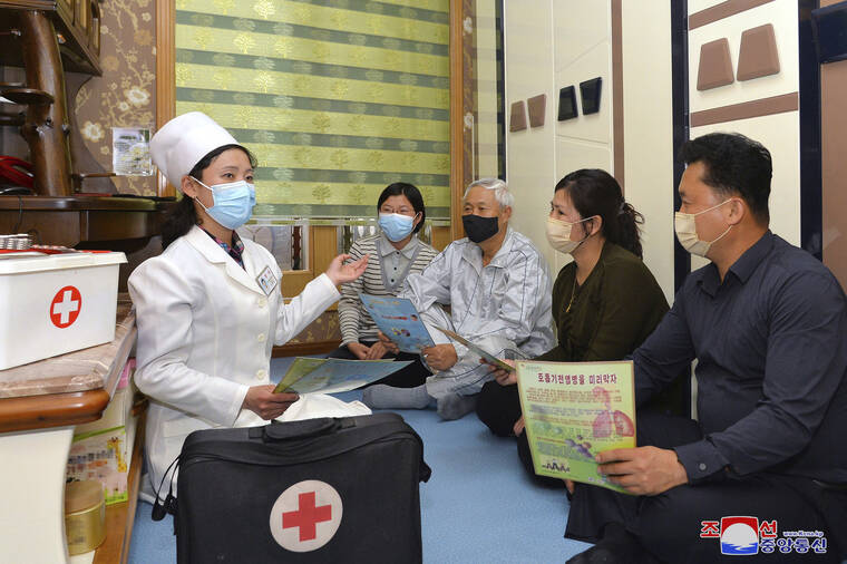 KOREAN CENTRAL NEWS AGENCY / KOREA NEWS SERVICE / AP
                                In this photo provided by the North Korean government, a doctor visits a family during an activity to raise public awareness of the COVID-19 prevention measures, in Pyongyang, North Korea Tuesday, May 17.