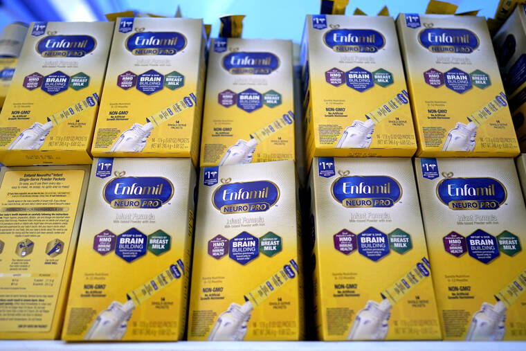 ASSOCIATED PRESS
                                Infant formula was stacked on a table during a baby formula drive to help with the shortage, May 14, in Houston. President Joe Biden has invoked the Defense Production Act to speed production of infant formula and has authorized flights to import supply from overseas.