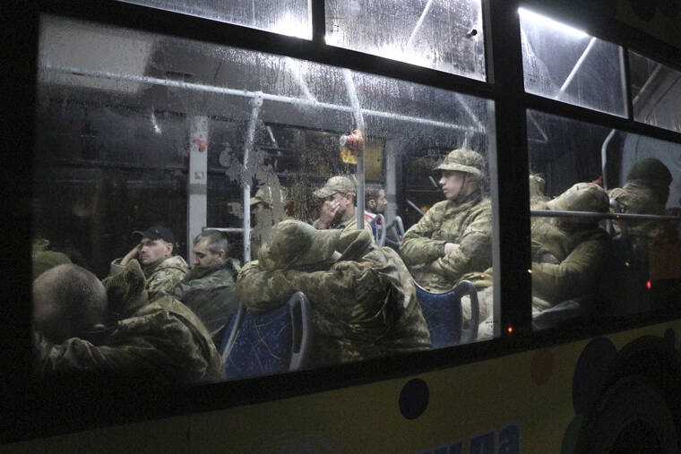 ASSOCIATED PRESS
                                Ukrainian servicemen sat in a bus after leaving Mariupol’s besieged Azovstal steel plant, near a penal colony, in Olyonivka, in territory under the government of the Donetsk People’s Republic, eastern Ukraine, today.