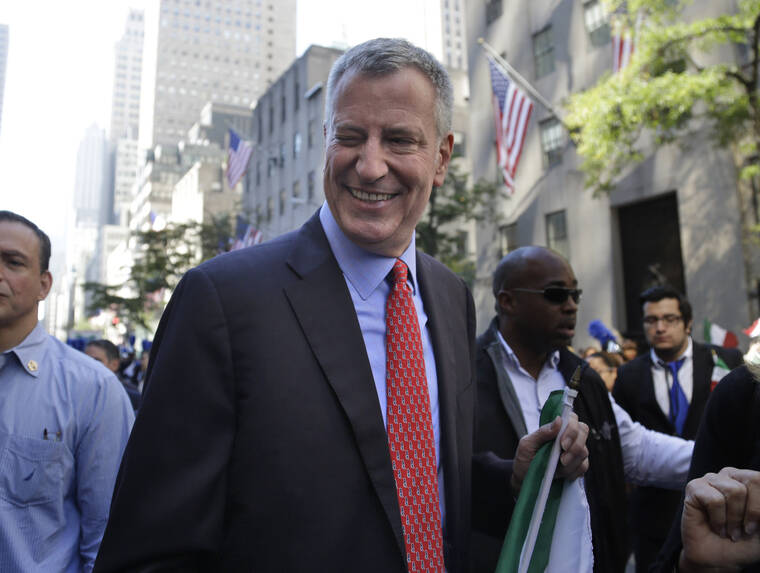 ASSOCIATED PRESS / 2015
                                New York City Mayor Bill de Blasio winks at someone during the Columbus Day Parade in New York. The former New York City Mayor says he will run for Congress in a redrawn district that includes his Brooklyn home. De Blasio announced Friday, May 20, on MSNBC’s “Morning Joe” that he will seek the Democratic nomination for the 10th Congressional District.