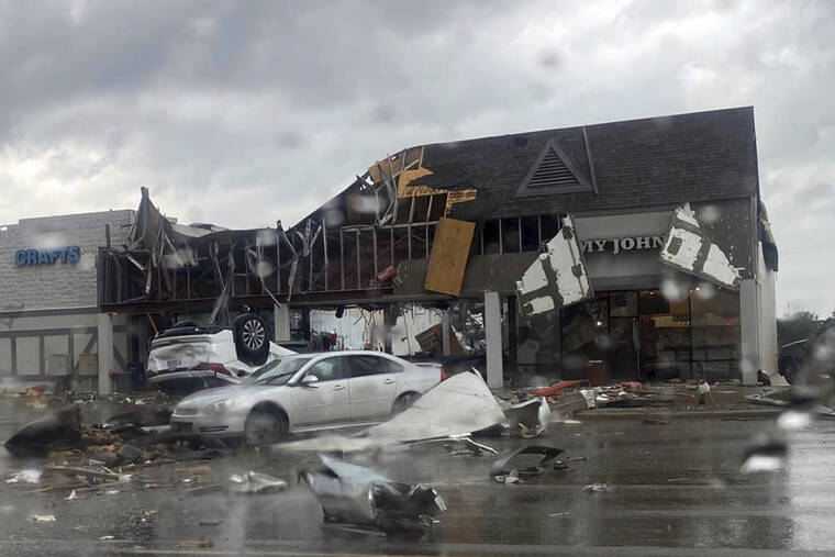 STEVEN BISCHER VIA AP
                                Damage following an apparent tornado in Gaylord, Mich.