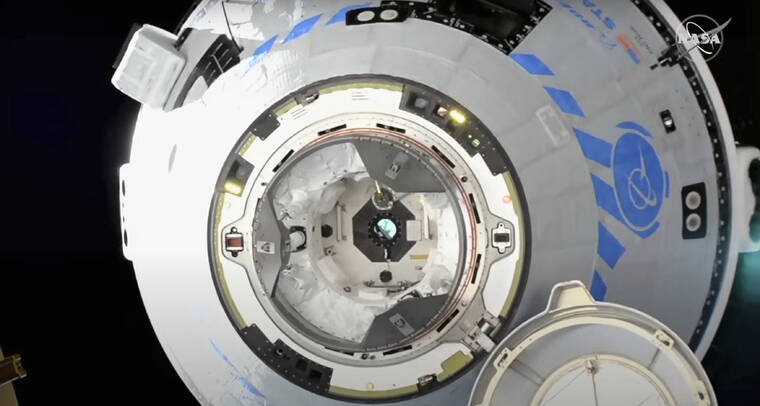 NASA / AP
                                This image from NASA TV shows the Boeing Starliner preparing to dock at the International Space Station.