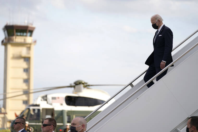 ASSOCIATED PRESS
                                President Joe Biden, right, disembarks from Air Force One on his arrival at Yokota Air Base in Fussa, on the outskirt of Tokyo, Japan.