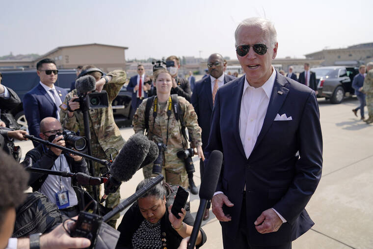 ASSOCIATED PRESS
                                President Joe Biden speaks before boarding Air Force One for a trip to Japan at Osan Air Base in Pyeongtaek, South Korea.