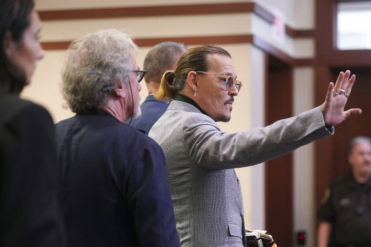 SHAWN THEW/POOL PHOTO VIA AP / MAY 19
                                Actor Johnny Depp waves as he leaves the courtroom at the Fairfax County Circuit Courthouse in Fairfax, Va. Actor Johnny Depp sued his ex-wife Amber Heard for libel in Fairfax County Circuit Court after she wrote an op-ed piece in The Washington Post in 2018 referring to herself as a “public figure representing domestic abuse.”