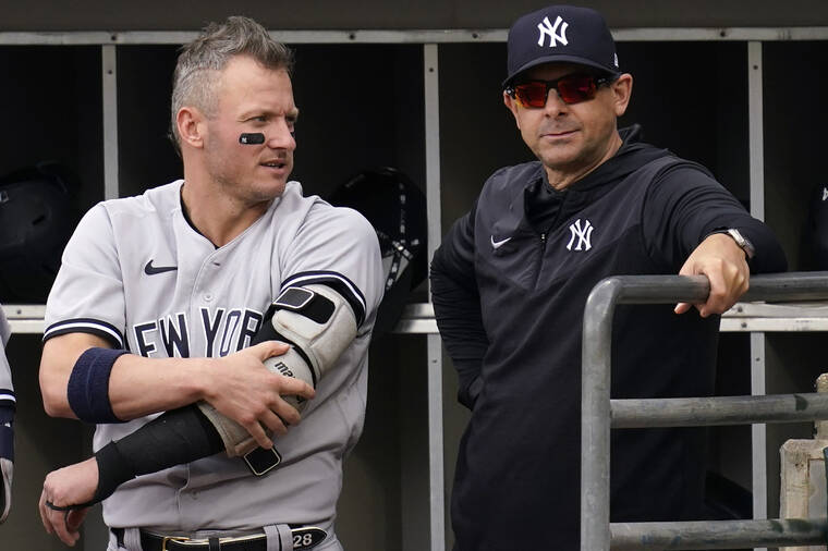 ASSOCIATED PRESS
                                New York Yankees’ Josh Donaldson, left, talked with manager Aaron Boone in the dugout during the first inning of a baseball game against the Chicago White Sox in Chicago, Sunday.