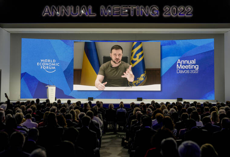 ASSOCIATED PRESS
                                Ukrainian President Volodymyr Zelenskyy displayed on a screen as he addresses the audience from Kyiv on a screen during the World Economic Forum in Davos, Switzerland, Monday, May 23. The annual meeting of the World Economic Forum is taking place in Davos from May 22 until May 26.