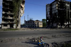 ASSOCIATED PRESS
                                A boy played in front of houses ruined by shelling in Borodyanka, Ukraine, today.