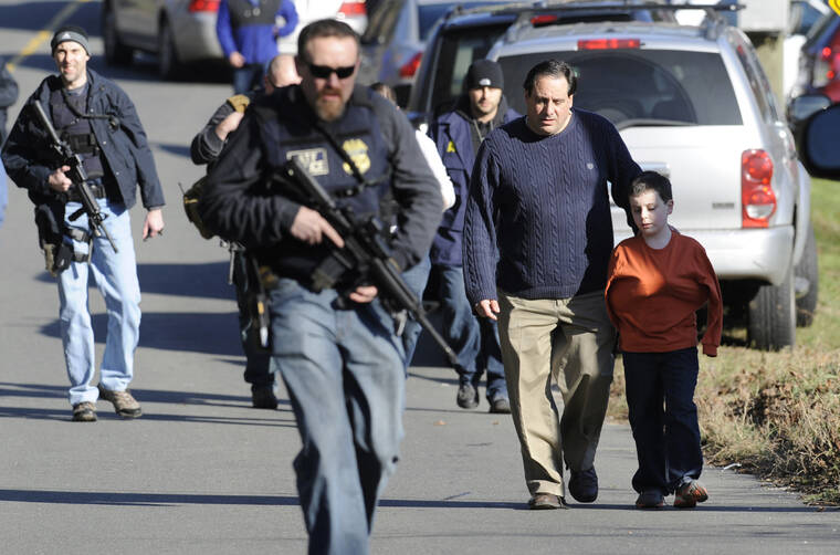 ASSOCIATED PRESS
                                Parents left a staging area, in December 2012, after being reunited with their children following a shooting at the Sandy Hook Elementary School in Newtown, Conn. Once again, multiple people were killed in a shooting at an elementary school, this time in Uvalde, Texas, today.