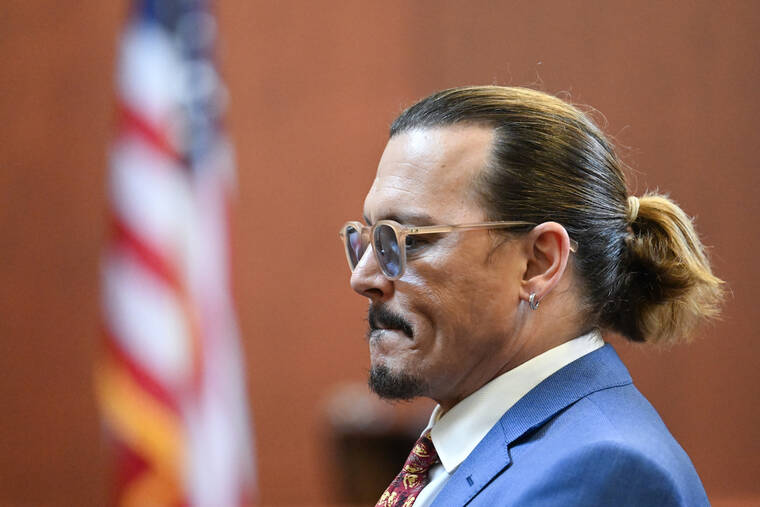 POOL PHOTO / AP
                                Actor Johnny Depp looks on in the courtroom at the Fairfax County Circuit Courthouse in Fairfax, Va.