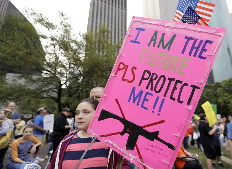 ASSOCIATED PRESS / MARCH 2018
                                Lillie Perez, 11, holds a sign during a “March for Our Lives” protest for gun legislation and school safety in Houston. Students and activists across the country planned events Saturday in conjunction with a Washington march spearheaded by teens from Marjory Stoneman Douglas High School in Parkland, Fla., where over a dozen people were killed in February.