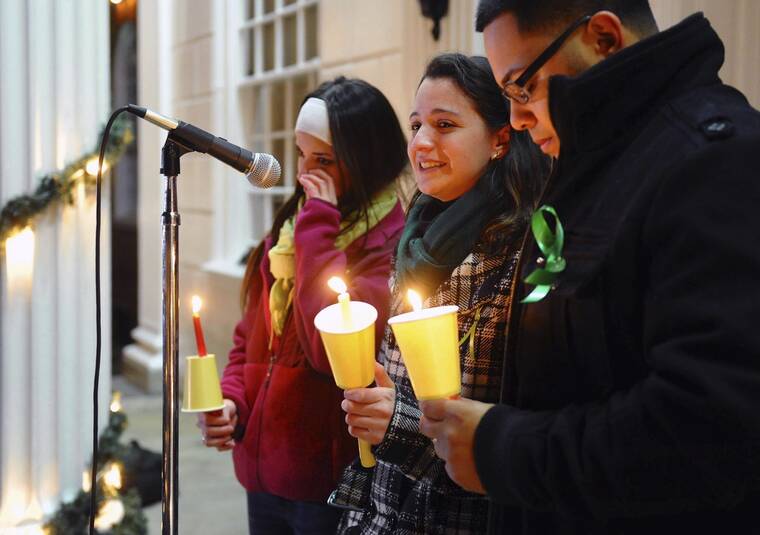 CHRISTIAN ABRAHAM/HEARST CONNECTICUT MEDIA VIA AP / DECEMBER 2012
                                Jillian Soto, center, thanks the hundreds of people who came out to attend a candlelight vigil in memory of victims from the mass shooting in Newtown, Conn., which was held behind Stratford High School on the Town Hall Green in Stratford, Conn. Jillian’s sister Vicki, a Stratford native, was a teacher at Sandy Hook Elementary School and was one of the victims of the shooting.