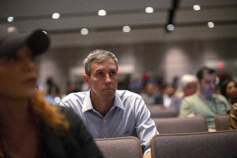 ASSOCIATED PRESS
                                Texas Democrat gubernatorial candidate Beto O’Rourke listens before interrupting a news conference headed by Texas Gov. Greg Abbott in Uvalde, Texas today.